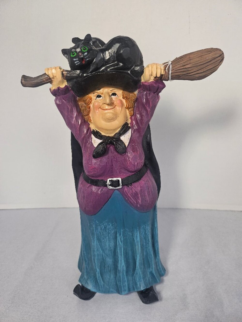 Transpac Resin Halloween Witch Figurine Holding Broom Above Head With Black Cat